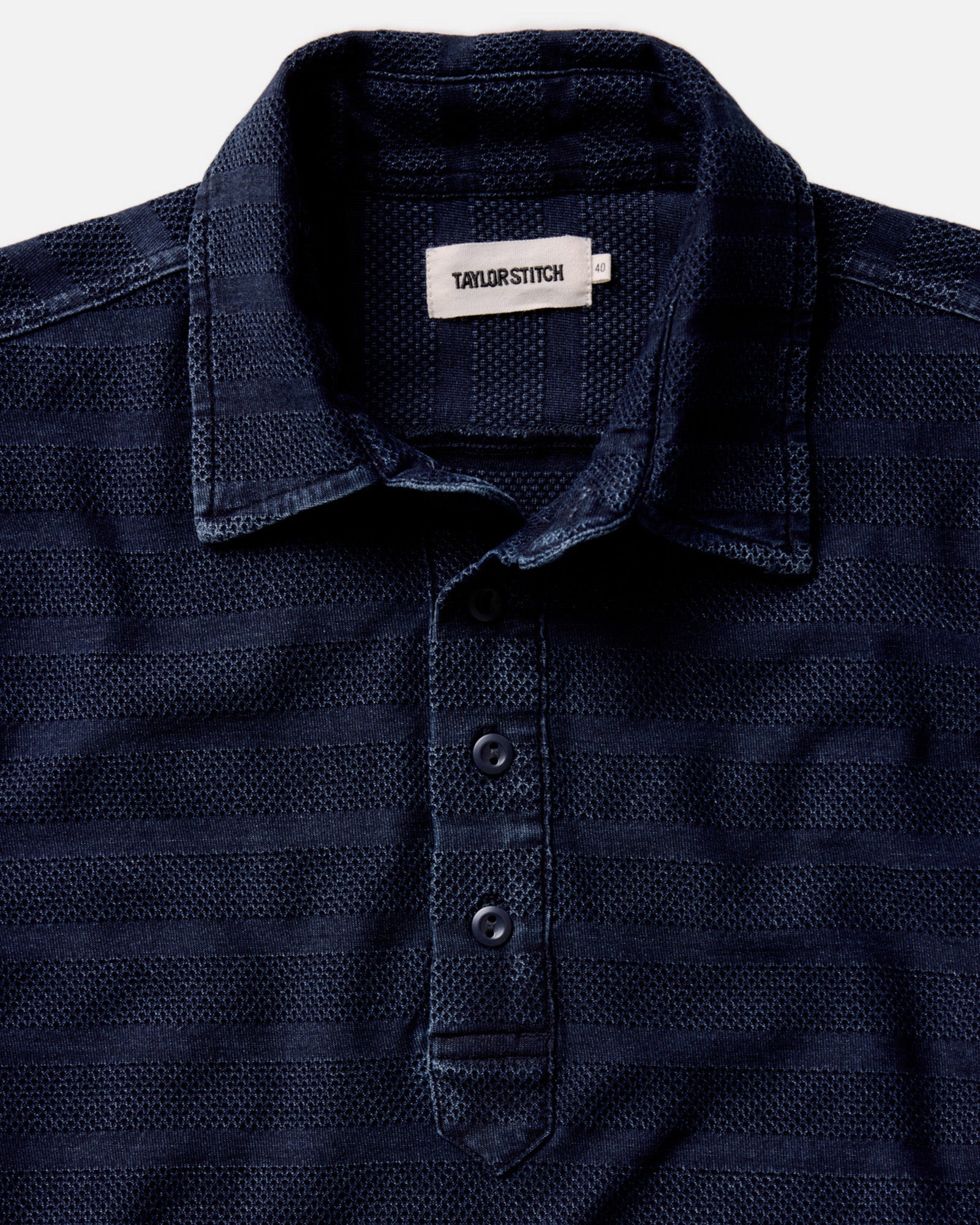 material shot of the collar on The Long Sleeve Polo in Indigo Knit Stripe, Knits by Taylor Stitch