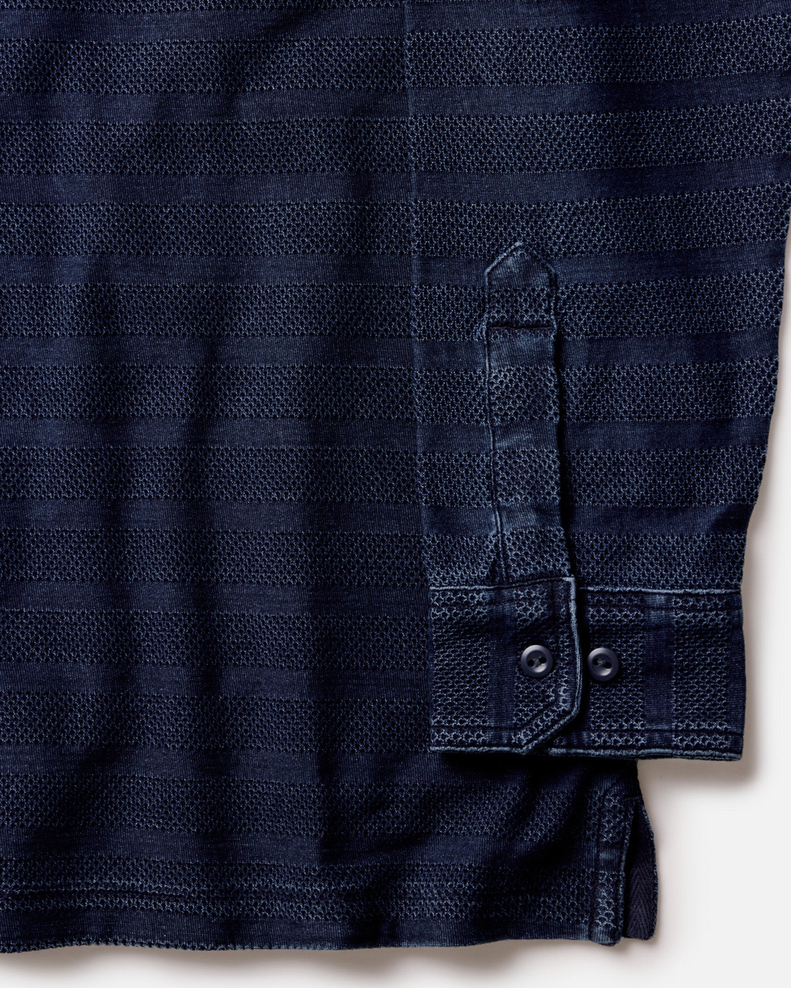 material shot of the cuff on The Long Sleeve Polo in Indigo Knit Stripe, Knits by Taylor Stitch