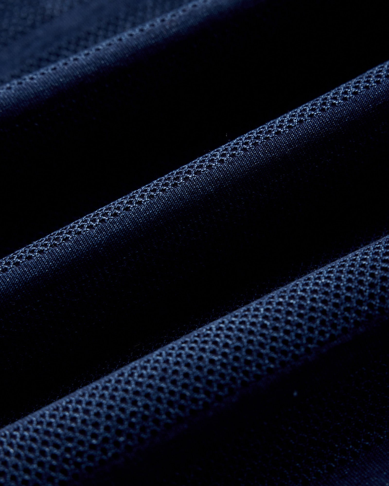 material shot of the fabric on The Long Sleeve Polo in Indigo Knit Stripe, Knits by Taylor Stitch