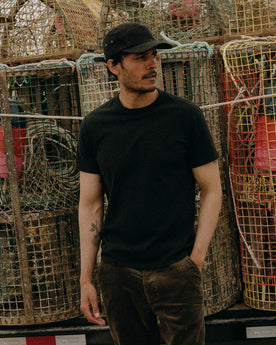 fit model showing off The Organic Cotton Tee in Black, Knits by Taylor Stitch