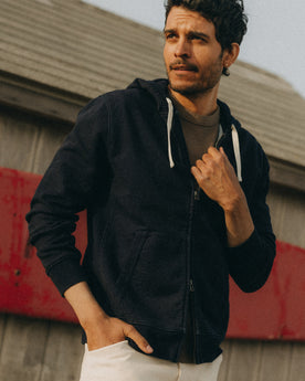 fit model posing in The Apres Zip Hoodie in Rinsed Indigo Terry, Knits by Taylor Stitch