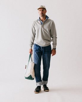 fit model walking wearing The Rugby Shirt in Heather Grey, Knits by Taylor Stitch