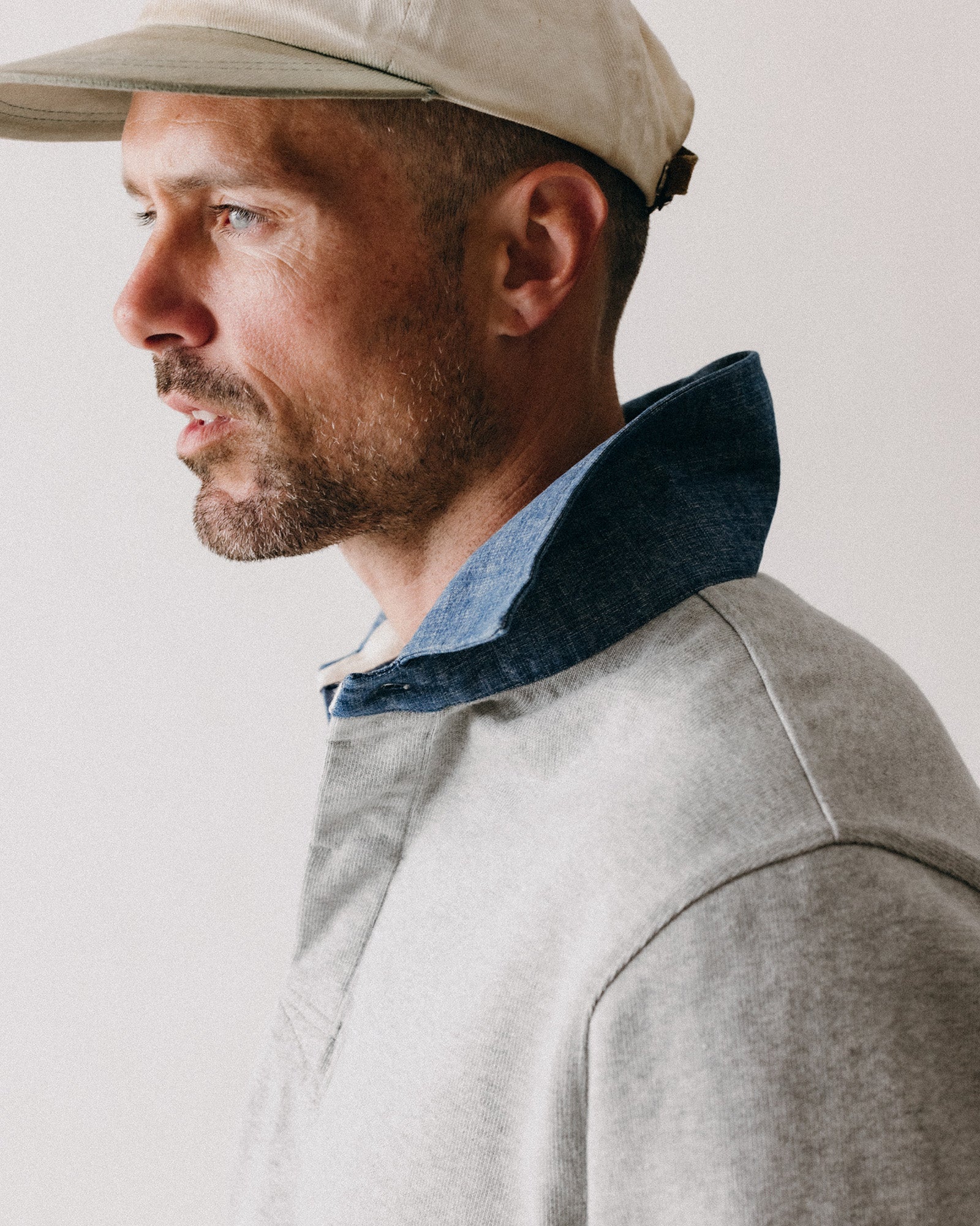 fit model showing off the side of The Rugby Shirt in Heather Grey, Knits by Taylor Stitch