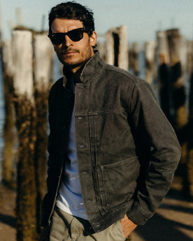 fit model posing in The Ryder Jacket in Coal Chipped Canvas, Outerwear by Taylor Stitch