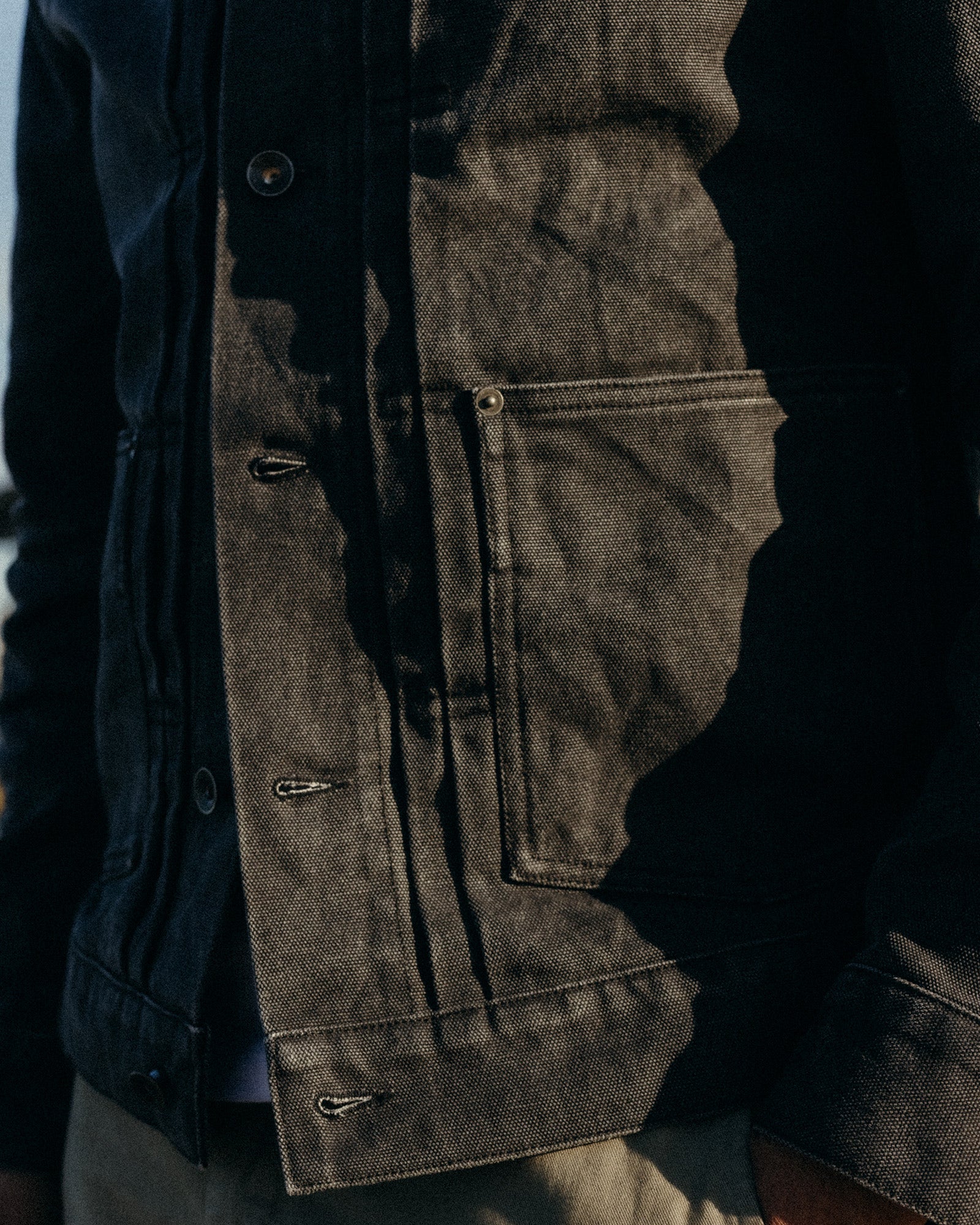 fit model showing off the pocket on The Ryder Jacket in Coal Chipped Canvas, Outerwear by Taylor Stitch