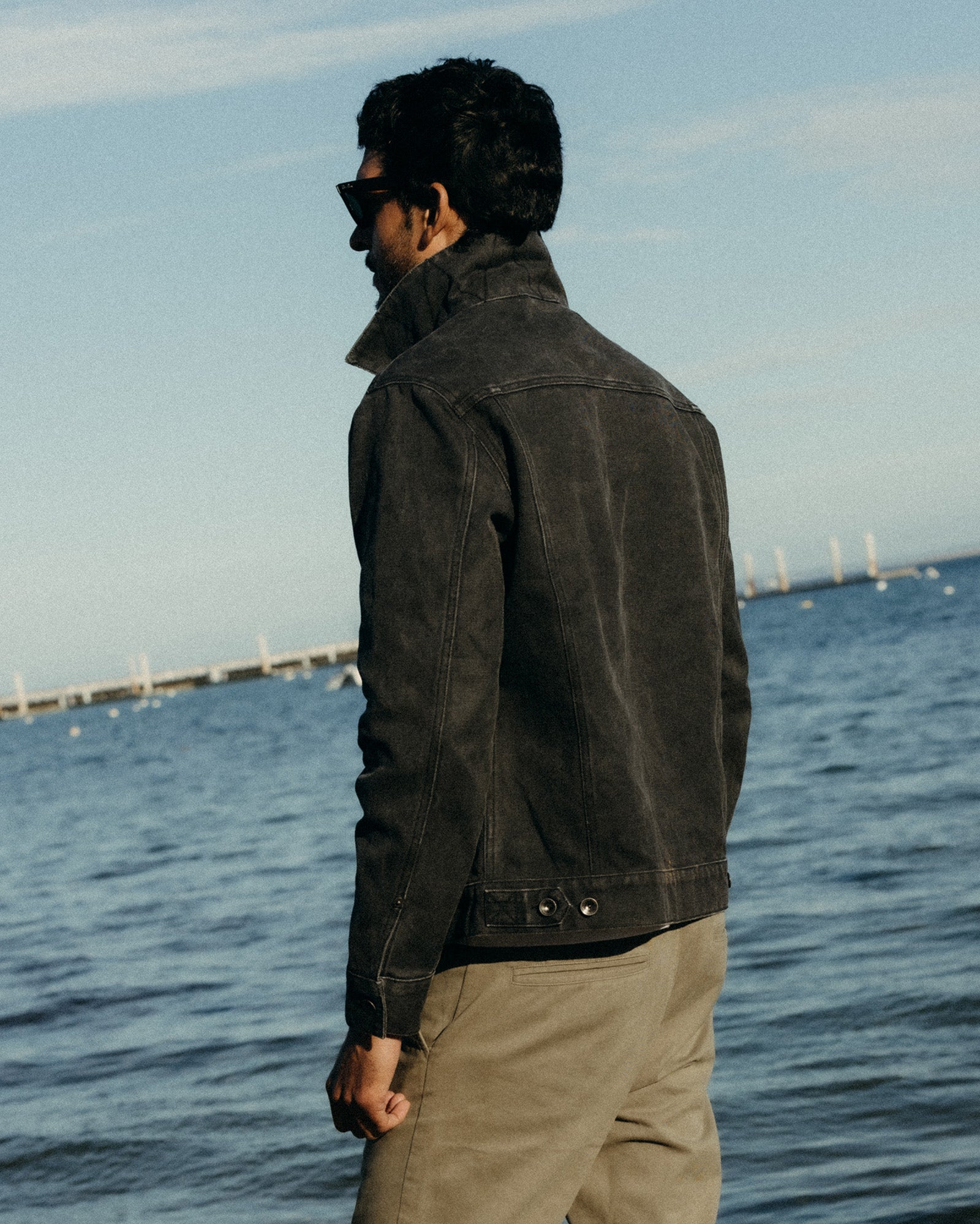 fit model showing off the back of The Ryder Jacket in Coal Chipped Canvas, Outerwear by Taylor Stitch