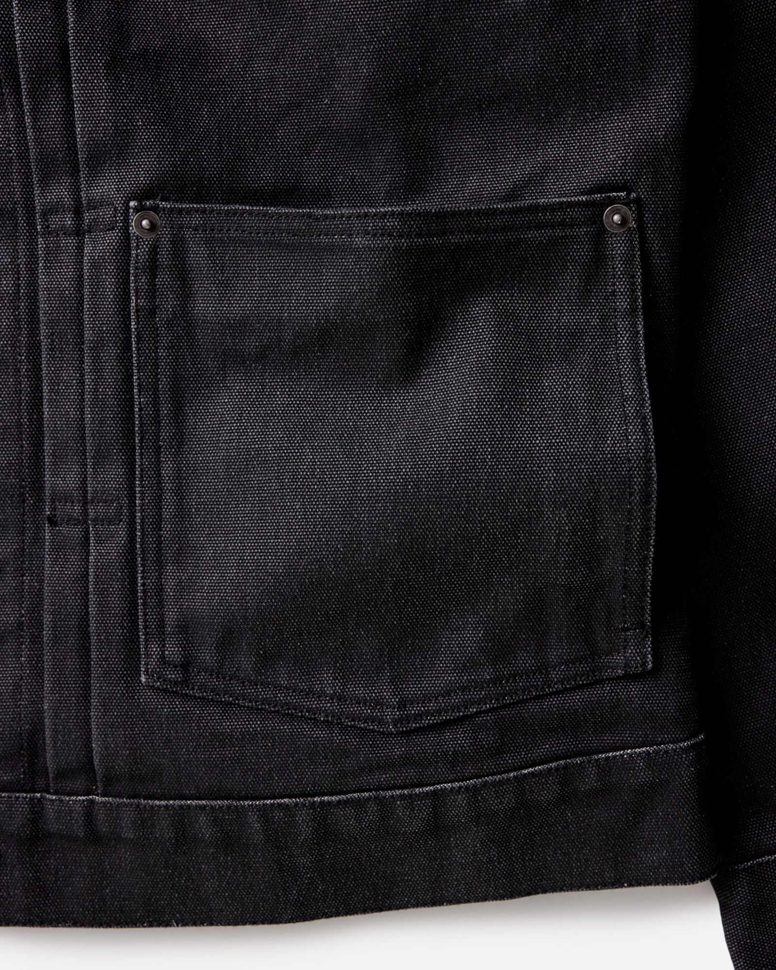 material shot of the pocket on The Ryder Jacket in Coal Chipped Canvas, Outerwear by Taylor Stitch