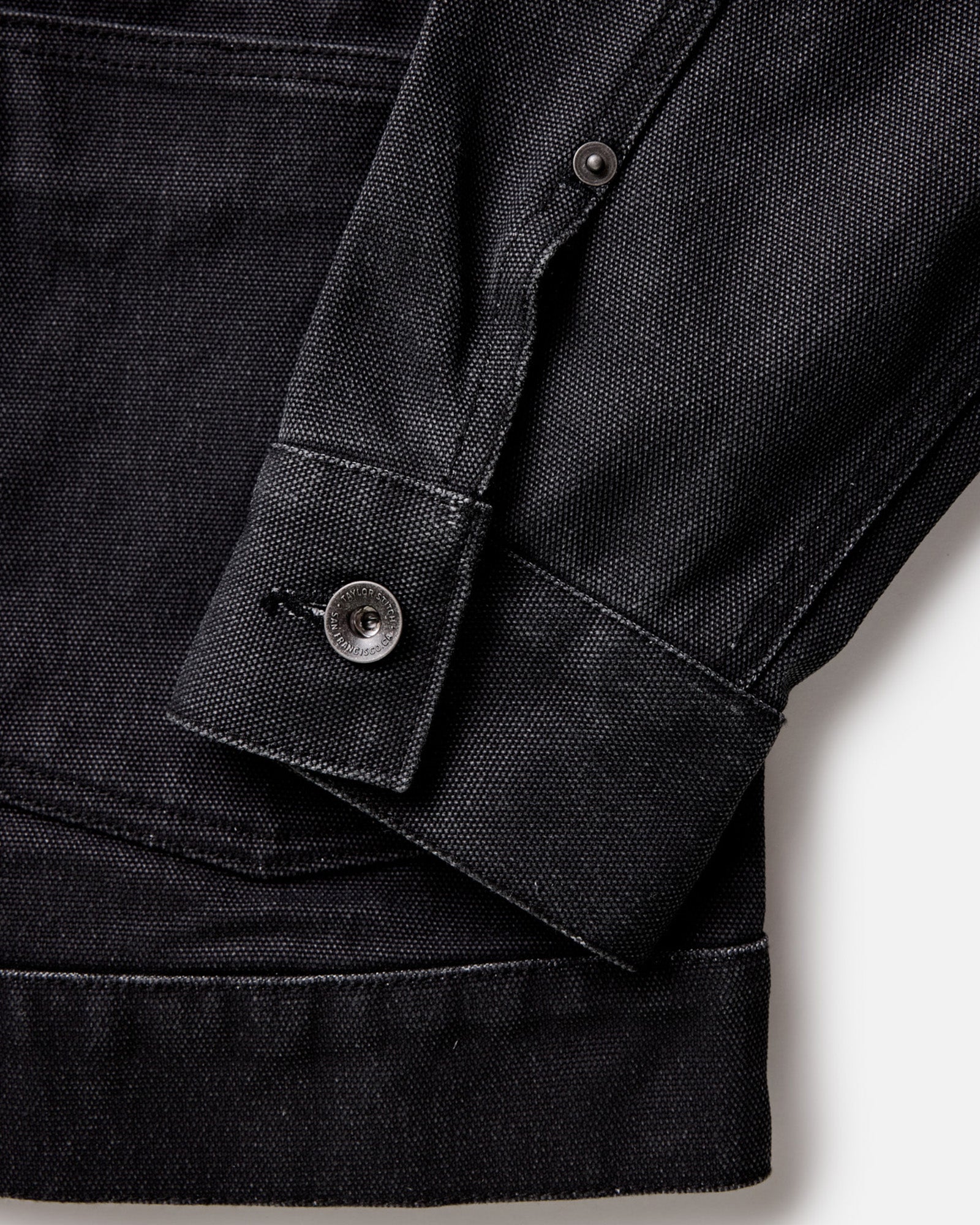 material shot of the cuff on The Ryder Jacket in Coal Chipped Canvas, Outerwear by Taylor Stitch