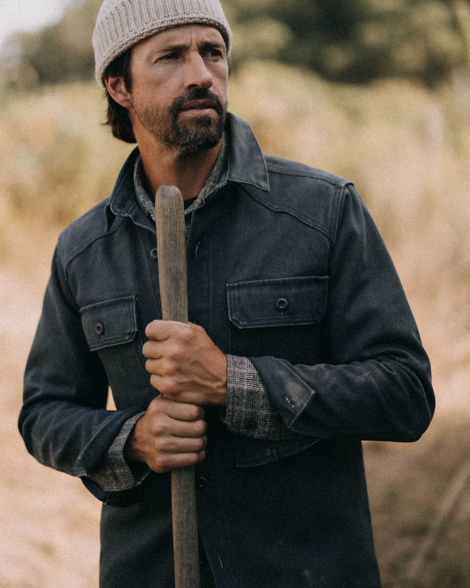 fit model standing wearing The Shop Shirt in Navy Chipped Canvas, Wovens by Taylor Stitch