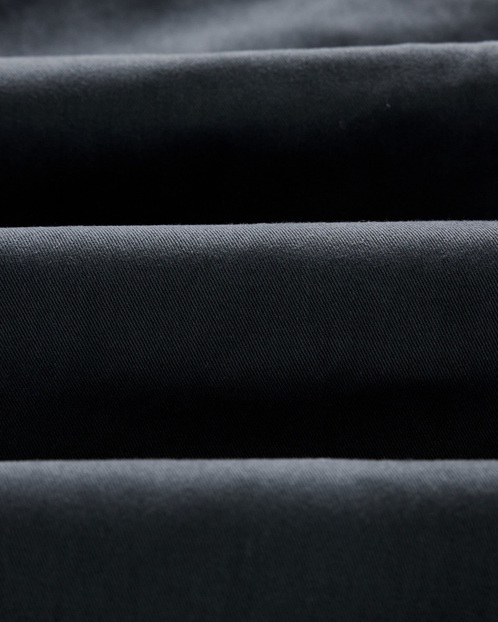 material shot of the twill fabric on The Slim Foundation Pant in Organic Navy, Bottoms by Taylor Stitch