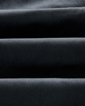 material shot of the twill fabric on The Slim Foundation Pant in Organic Navy, Bottoms by Taylor Stitch