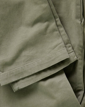 material shot of the leg cuffs on The Slim Foundation Pant in Organic Smoked Olive, Bottoms by Taylor Stitch