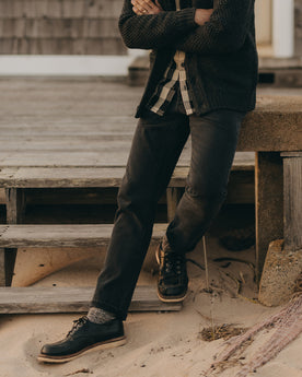 fit model posing in The Slim Jean in Washed Black Organic Slub Selvedge, Bottoms by Taylor Stitch