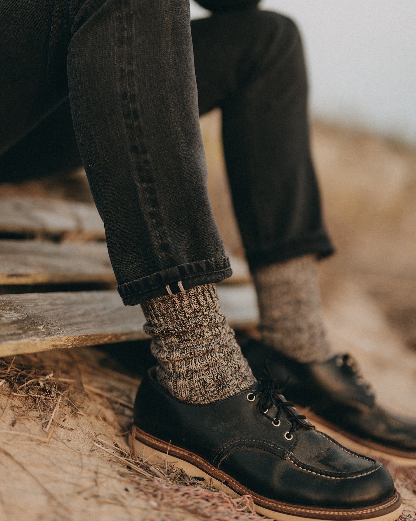 fit model showing off the cuffs on The Slim Jean in Washed Black Organic Slub Selvedge, Bottoms by Taylor Stitch