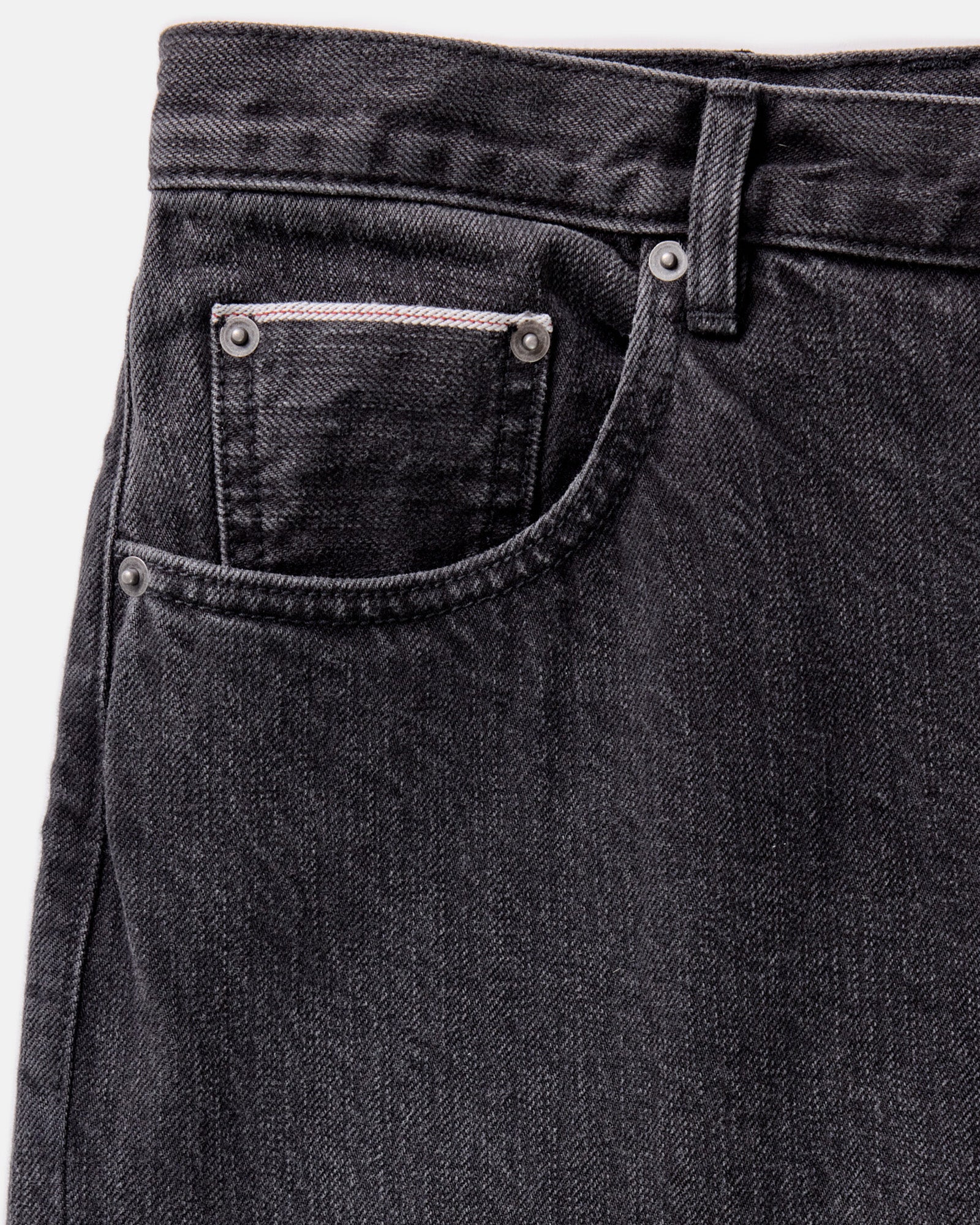 material shot of the pocket on The Slim Jean in Washed Black Organic Slub Selvedge, Bottoms by Taylor Stitch