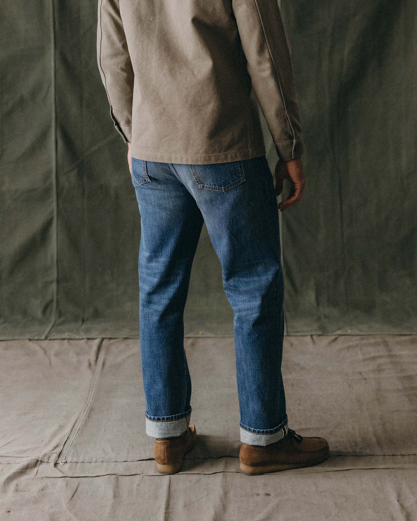 fit model showing off the back of The Straight Jean in Mid Wash Organic Selvedge, Bottoms by Taylor Stitch