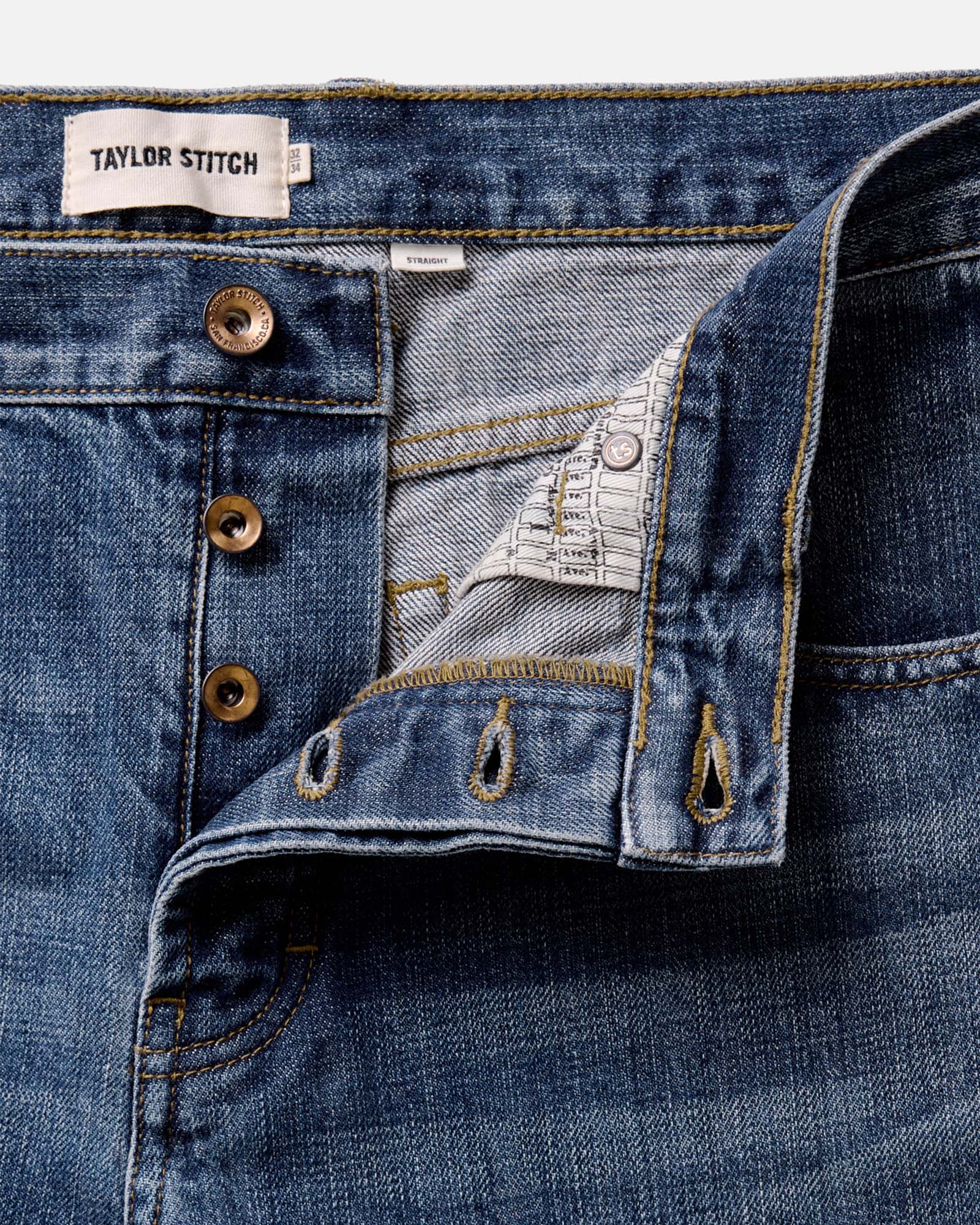 material shot of the buttons on The Straight Jean in Mid Wash Organic Selvedge, Bottoms by Taylor Stitch
