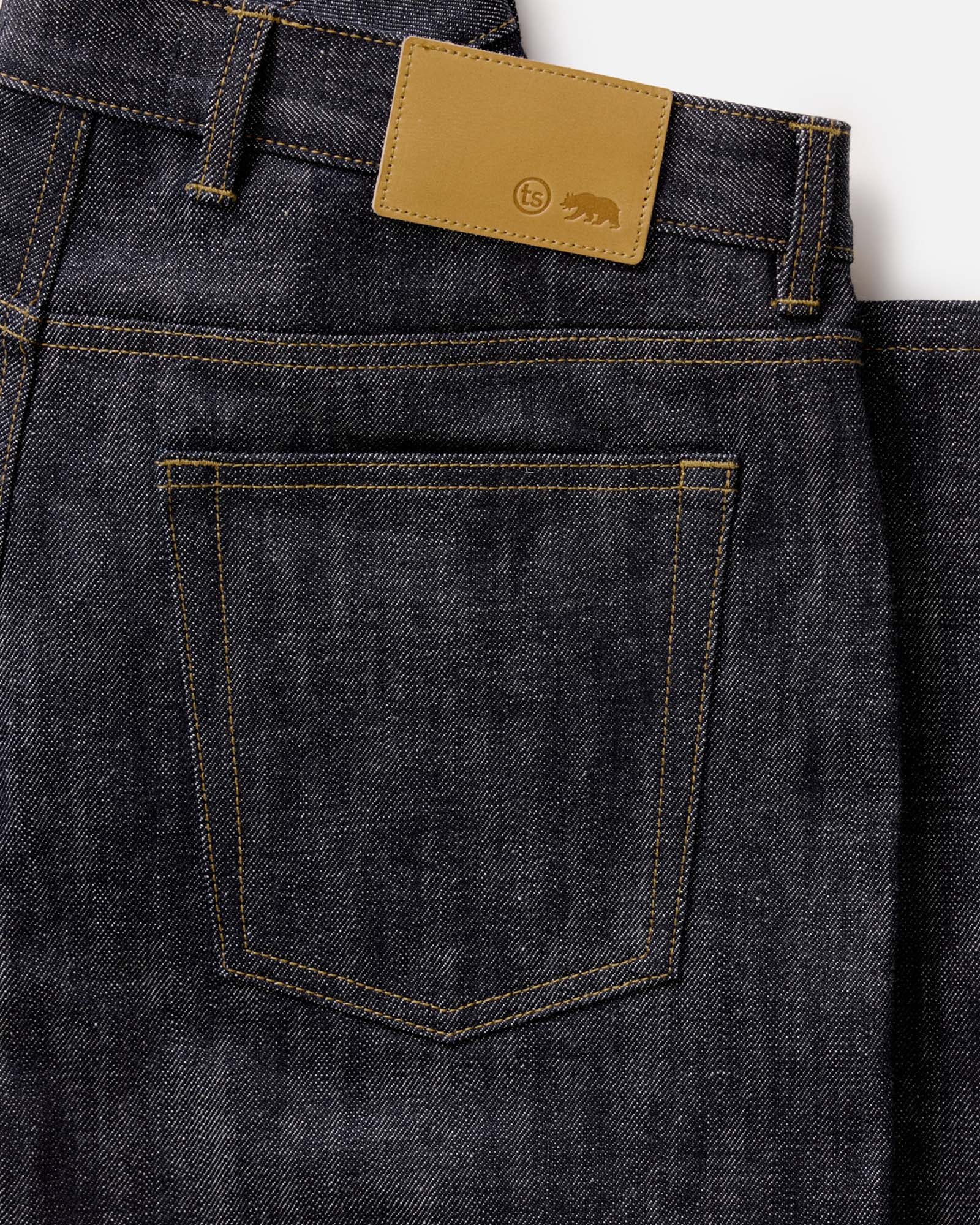 material shot of the back pocket on The Straight Jean in Rigid Organic Selvedge, Bottoms by Taylor Stitch