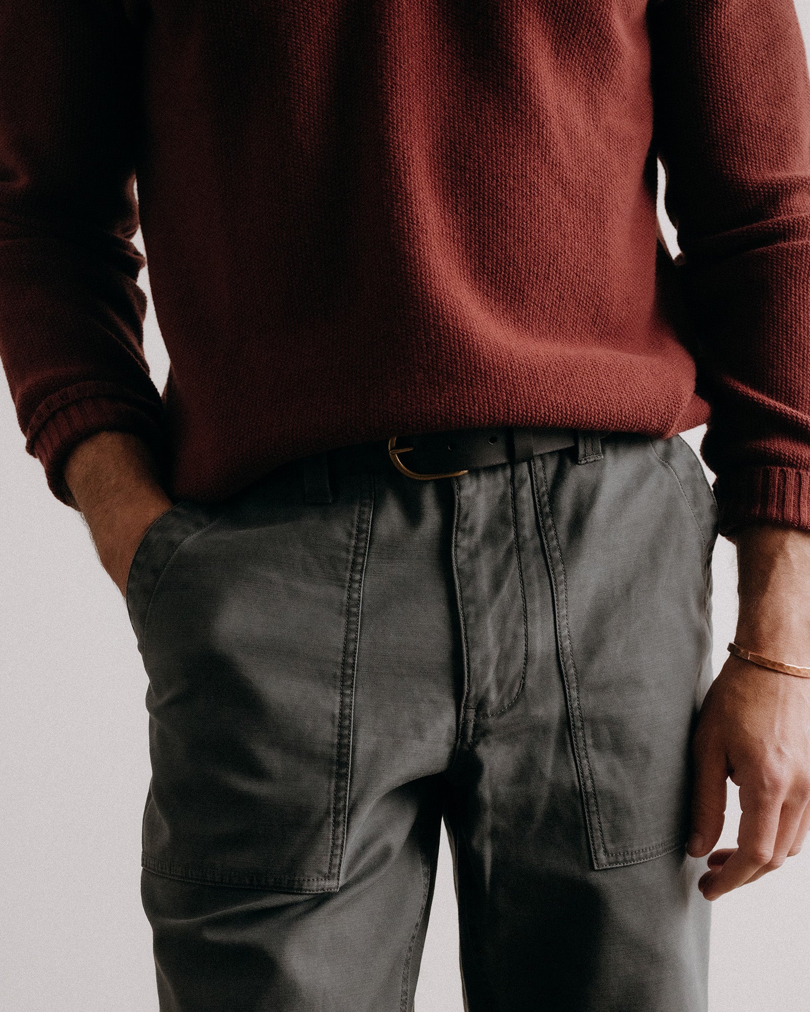 fit model posing in The Surplus Pant in Faded Black Reverse Sateen, Bottoms by Taylor Stitch