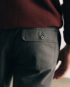 fit model showing off the back pocket on The Surplus Pant in Faded Black Reverse Sateen, Bottoms by Taylor Stitch