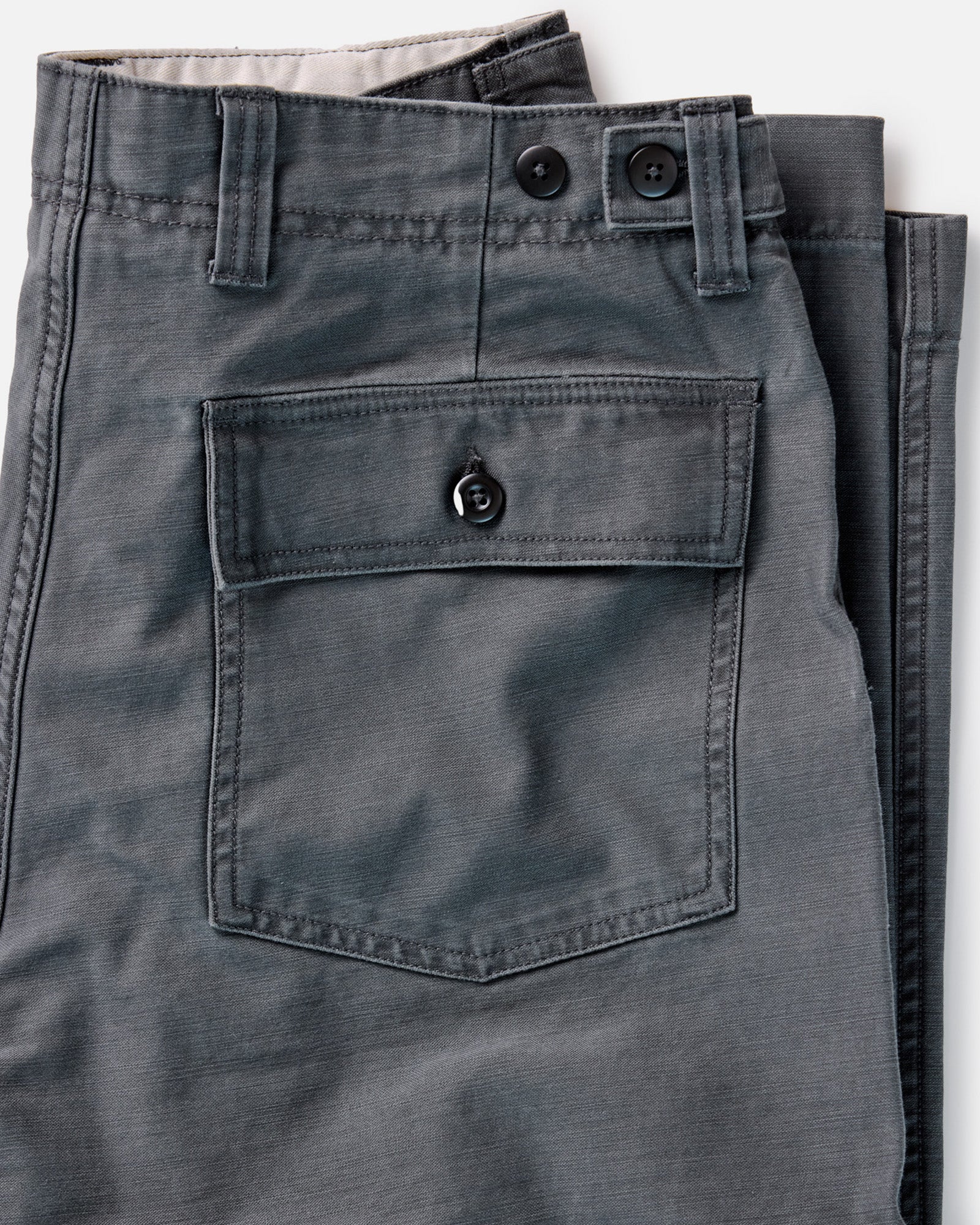 material shot of the back pocket on The Surplus Pant in Faded Black Reverse Sateen, Bottoms by Taylor Stitch