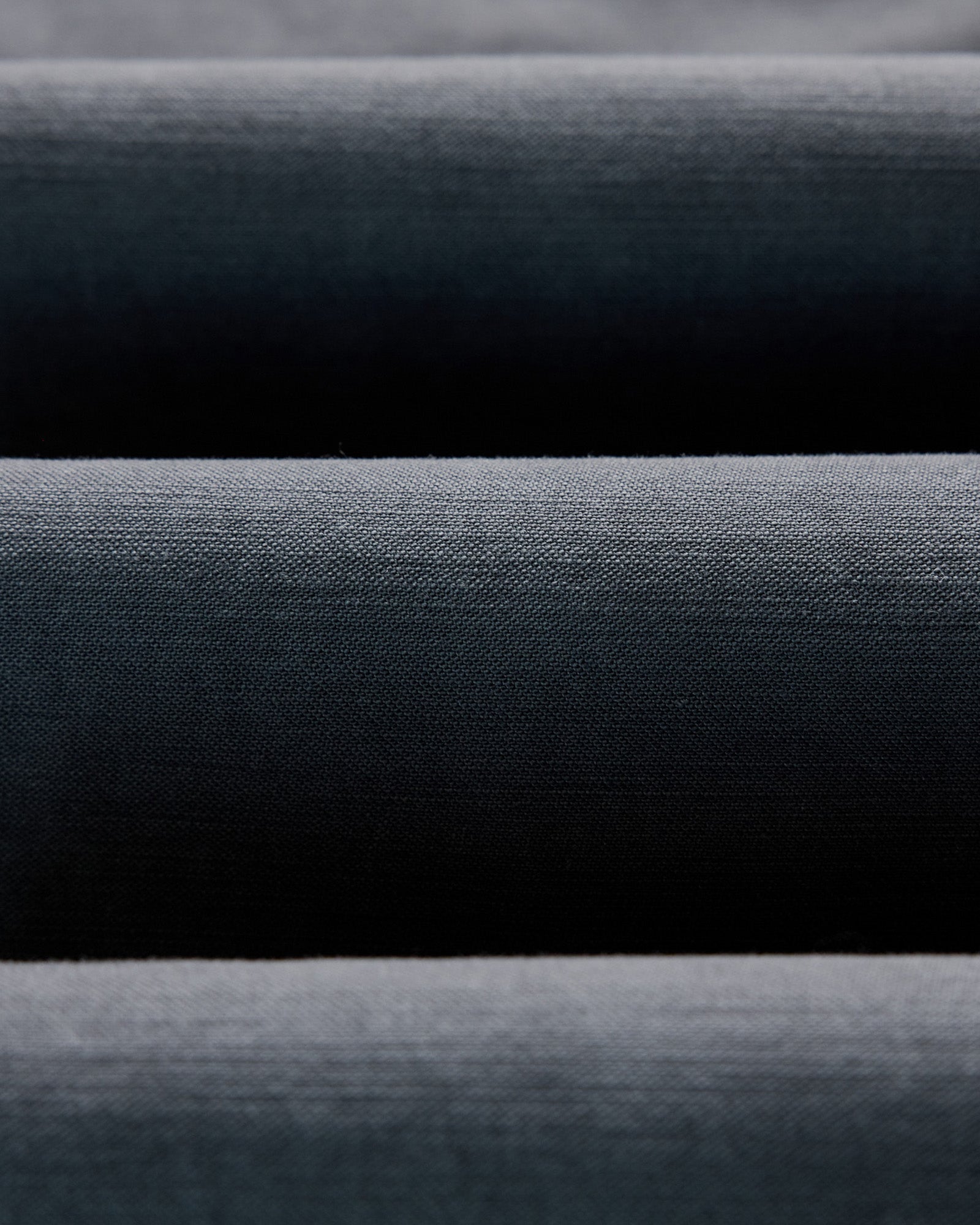 material shot of the fabric on The Surplus Pant in Faded Black Reverse Sateen, Bottoms by Taylor Stitch