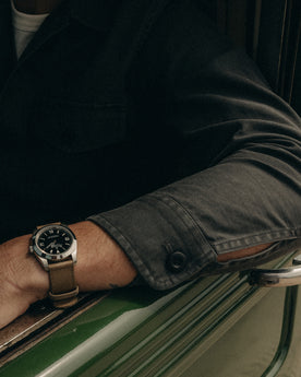 fit model showing off the sleeve on The Surplus Shirt in Faded Black Reverse Sateen, Wovens by Taylor Stitch