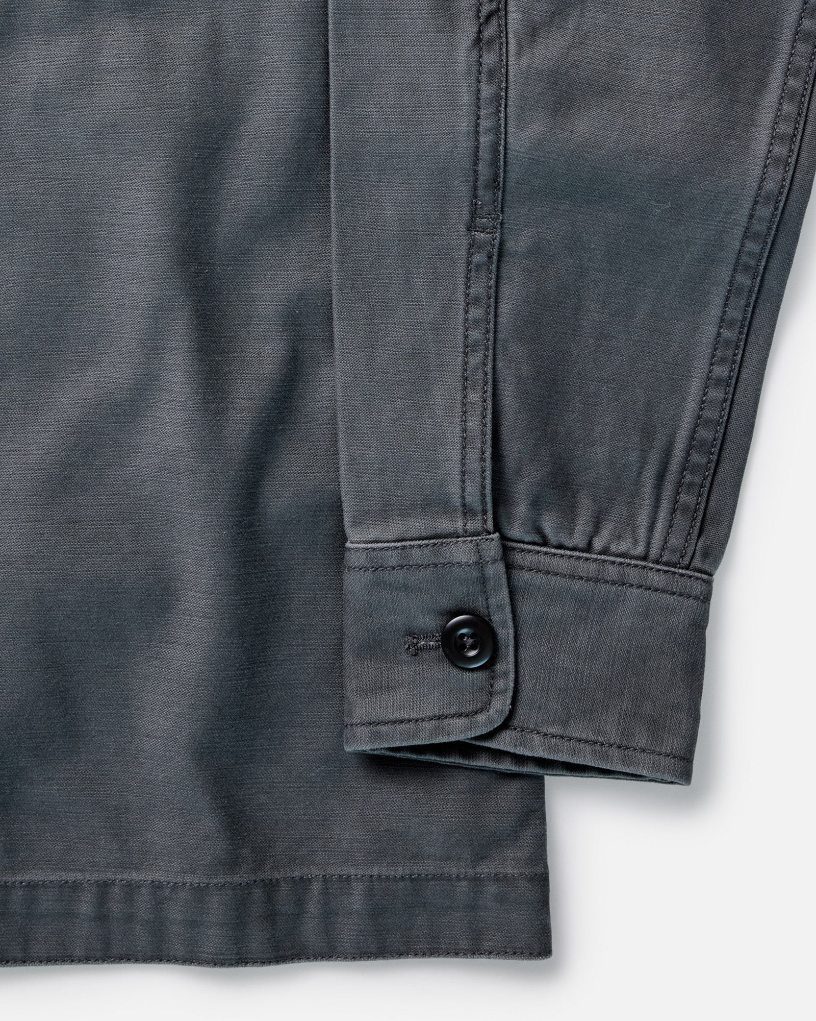 material shot of the sleeve on The Surplus Shirt in Faded Black Reverse Sateen, Wovens by Taylor Stitch