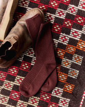 editorial flatlay of The Waffle Sock in Burgundy, Accessories by Taylor Stitch
