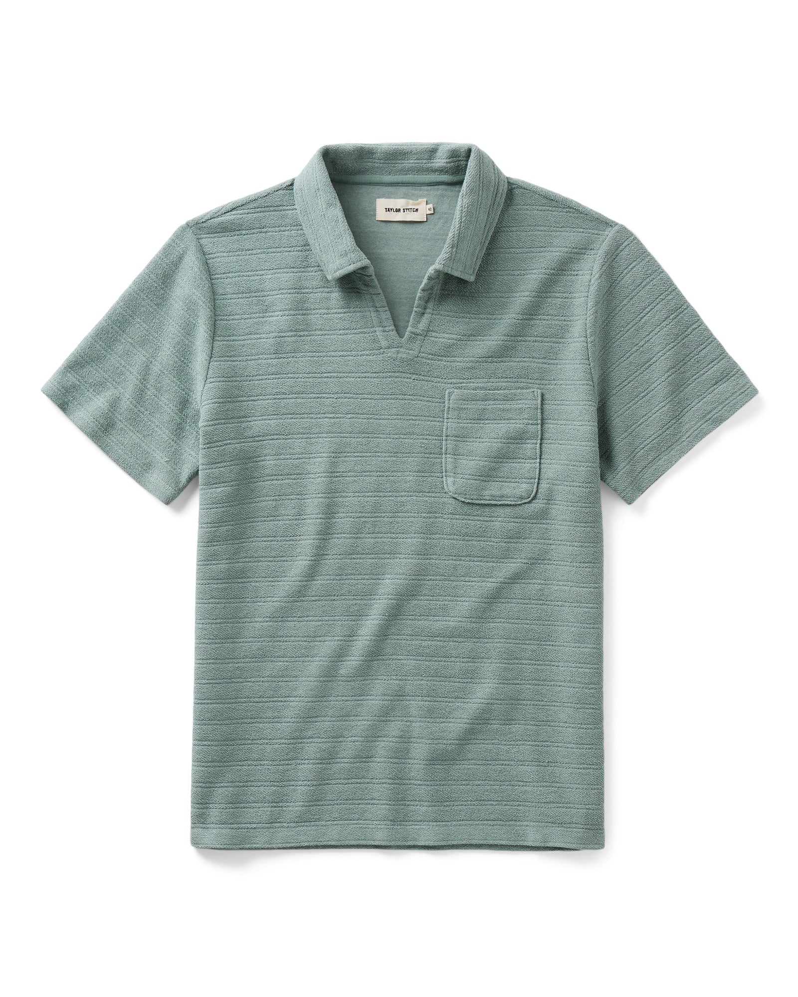 flatlay of The Meridian Polo in Faded Pine, Knits by Taylor Stitch