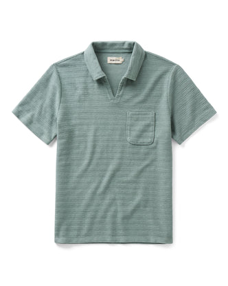 flatlay of The Meridian Polo in Faded Pine