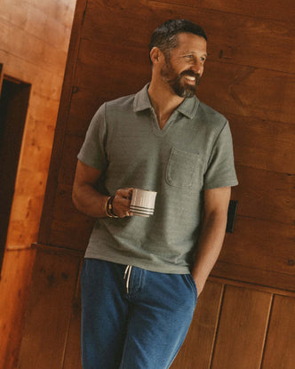 fit model showing off The Meridian Polo in Faded Pine