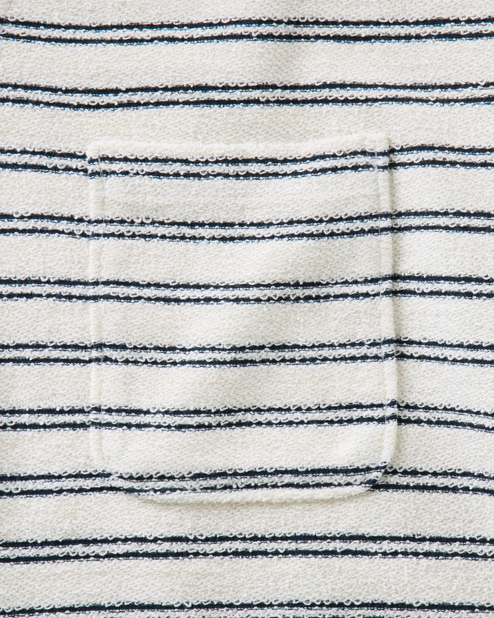 material shot of the pocket on The Meridian Polo in Marine Stripe, Knits by Taylor Stitch