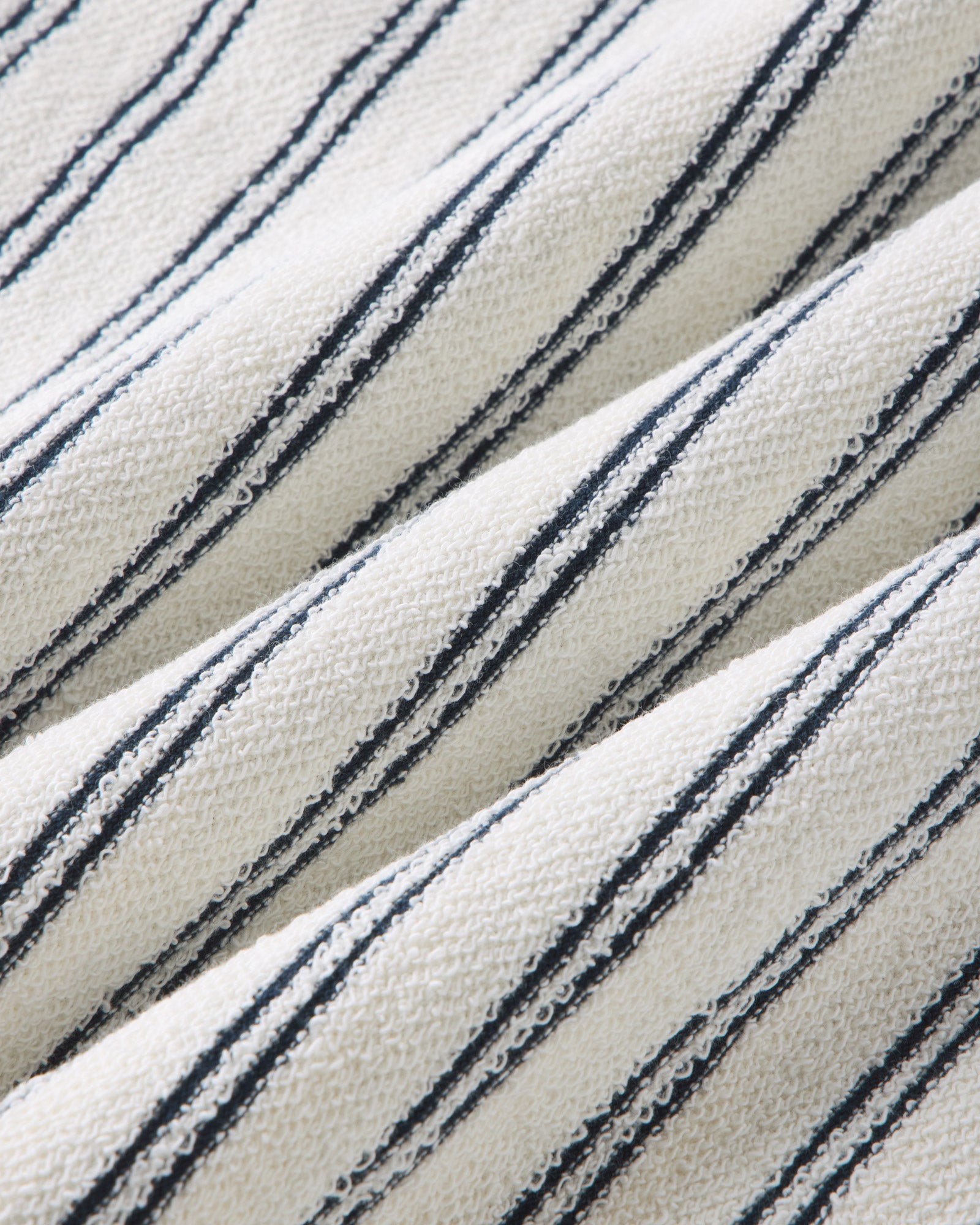 material shot of the fabric on The Meridian Polo in Marine Stripe, Knits by Taylor Stitch