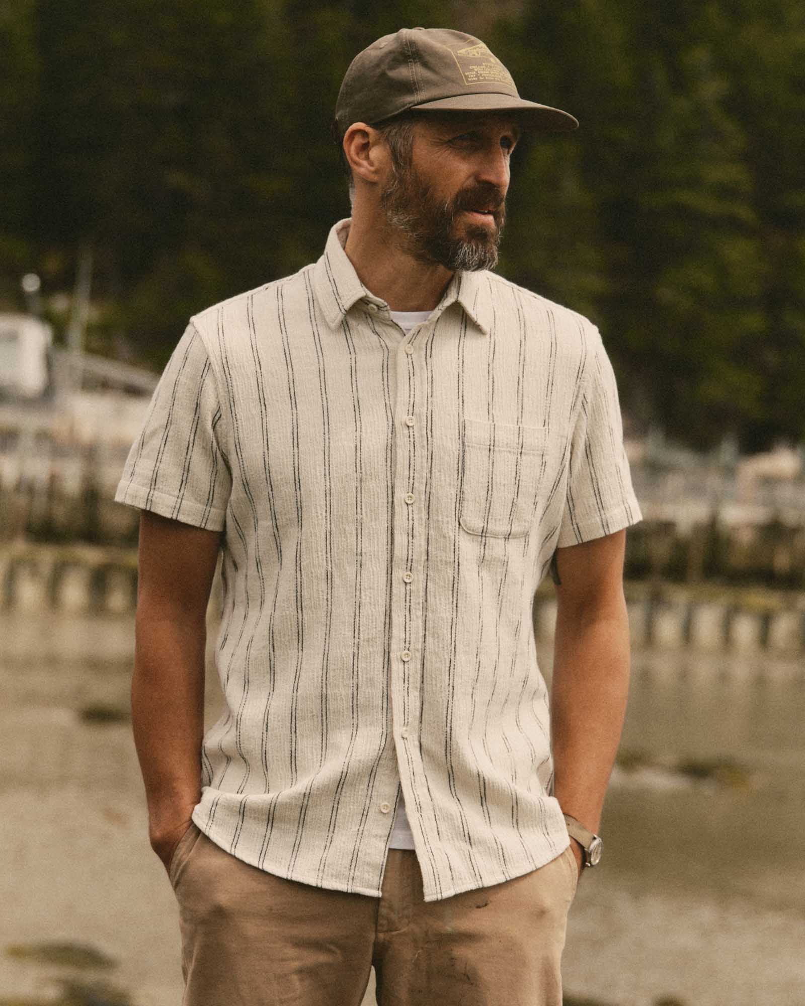 fit model posing in The Short Sleeve California in Tide Stripe Hacci, Wovens by Taylor Stitch
