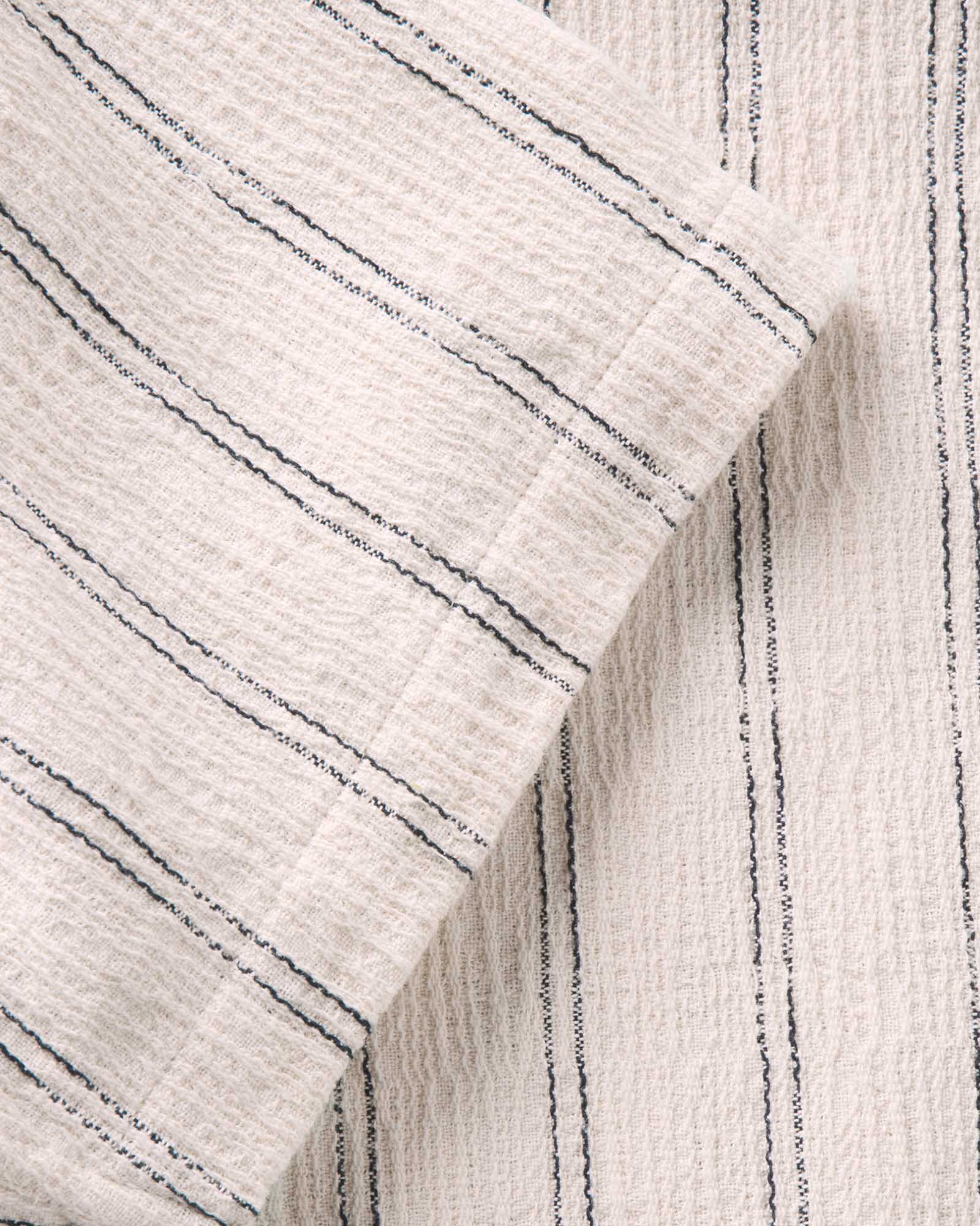 material shot of the sleeve on The Short Sleeve California in Tide Stripe Hacci, Wovens by Taylor Stitch