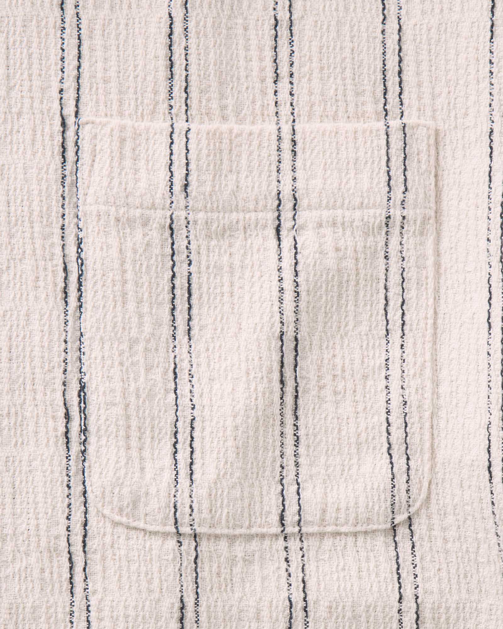 material shot of the pocket on The Short Sleeve California in Tide Stripe Hacci, Wovens by Taylor Stitch