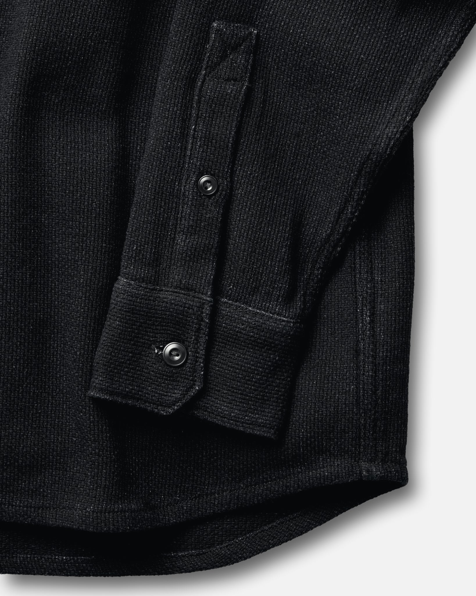 material shot of the sleeve on The Division Shirt in Black Indigo, Wovens by Taylor Stitch