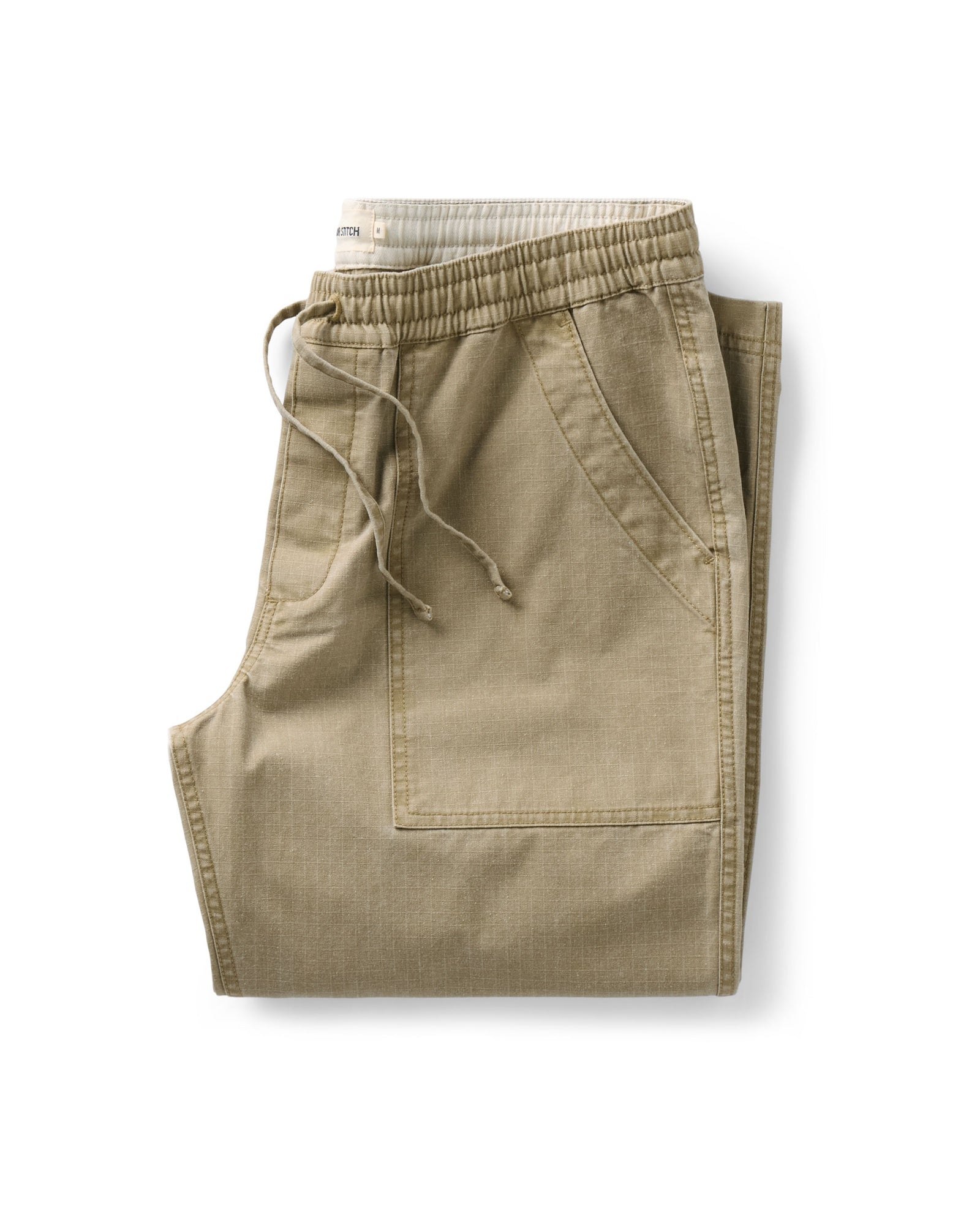 folded flatlay of The Breakwater Pant in Field Khaki Ripstop, Bottoms by Taylor Stitch