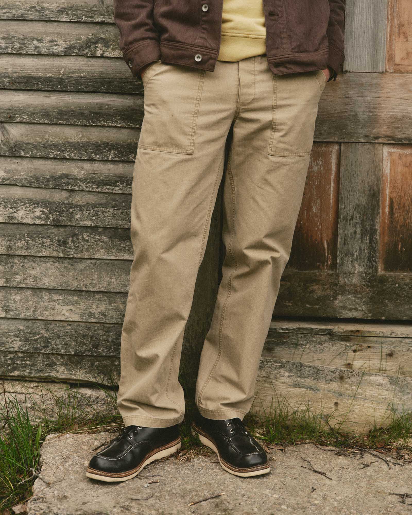 fit model posing in The Breakwater Pant in Field Khaki Ripstop, Bottoms by Taylor Stitch