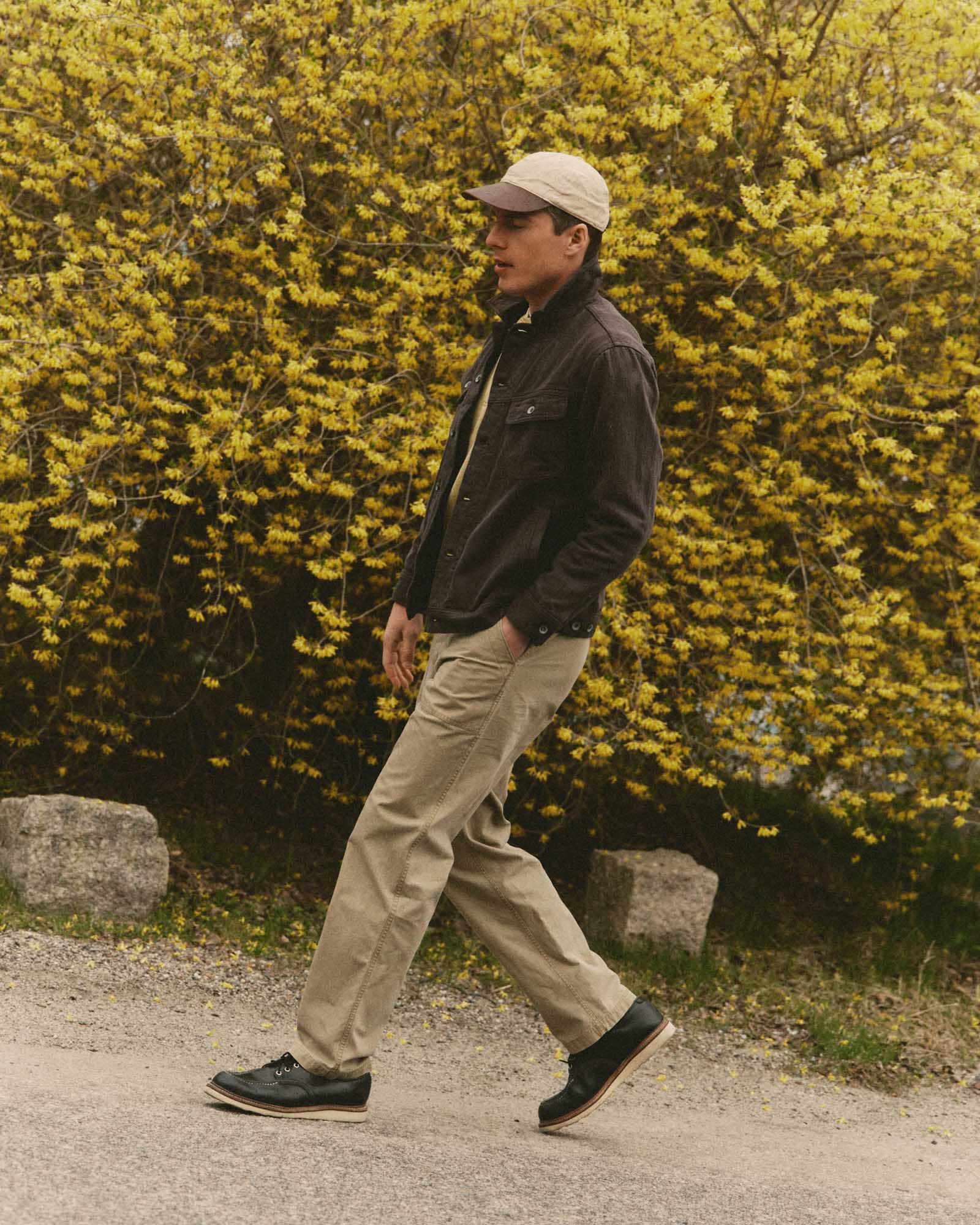fit model walking wearing The Breakwater Pant in Field Khaki Ripstop, Bottoms by Taylor Stitch