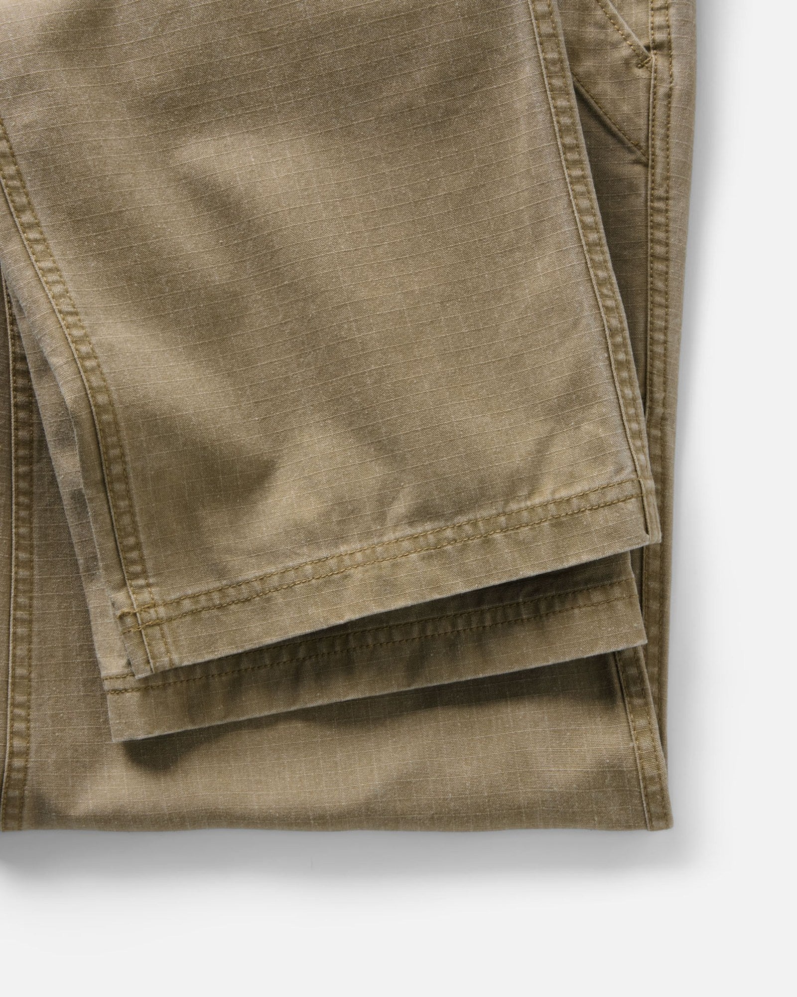 material shot of the hem on The Breakwater Pant in Field Khaki Ripstop, Bottoms by Taylor Stitch