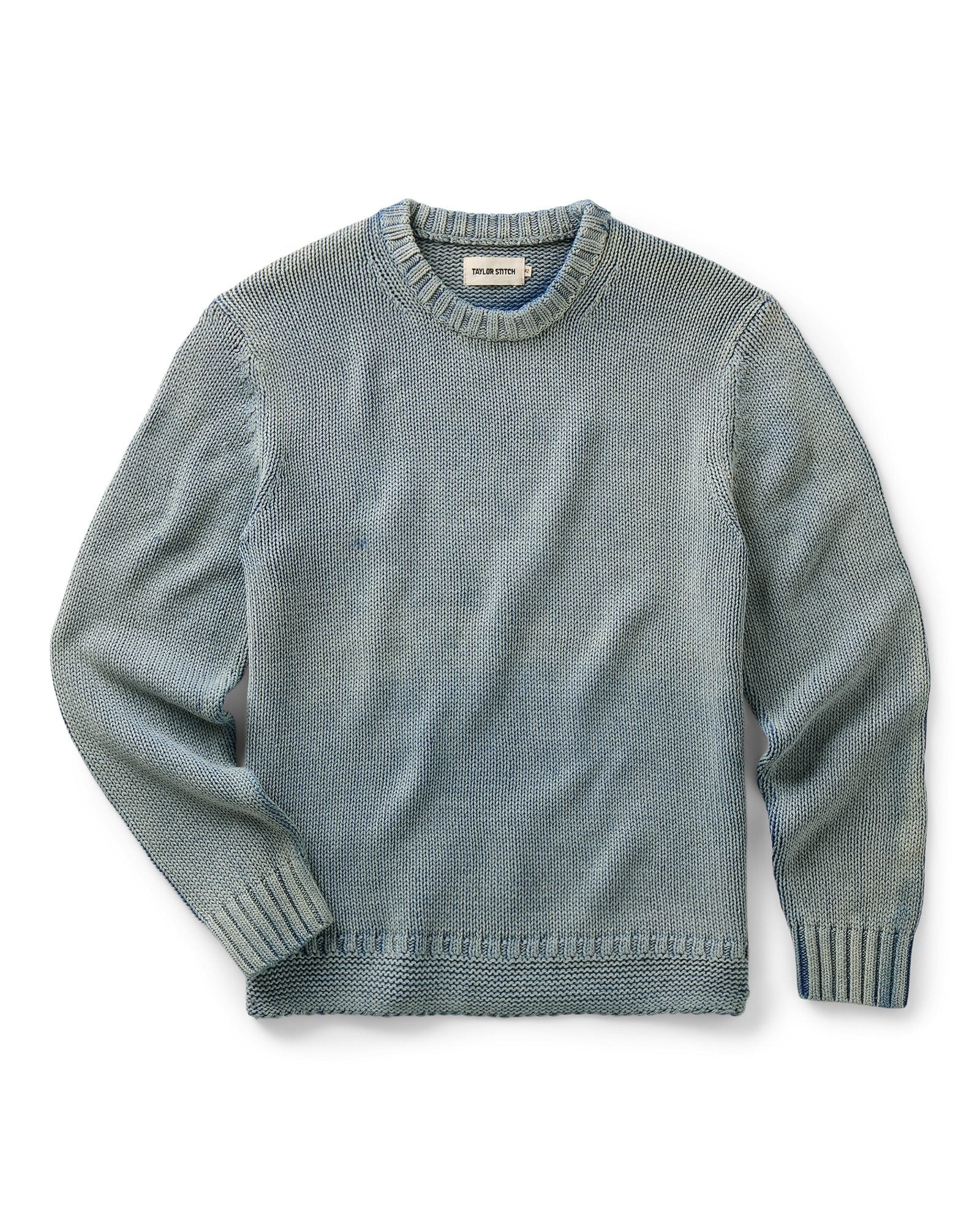 flatlay of The Dory Crew Sweater in Washed Indigo, Knits by Taylor Stitch