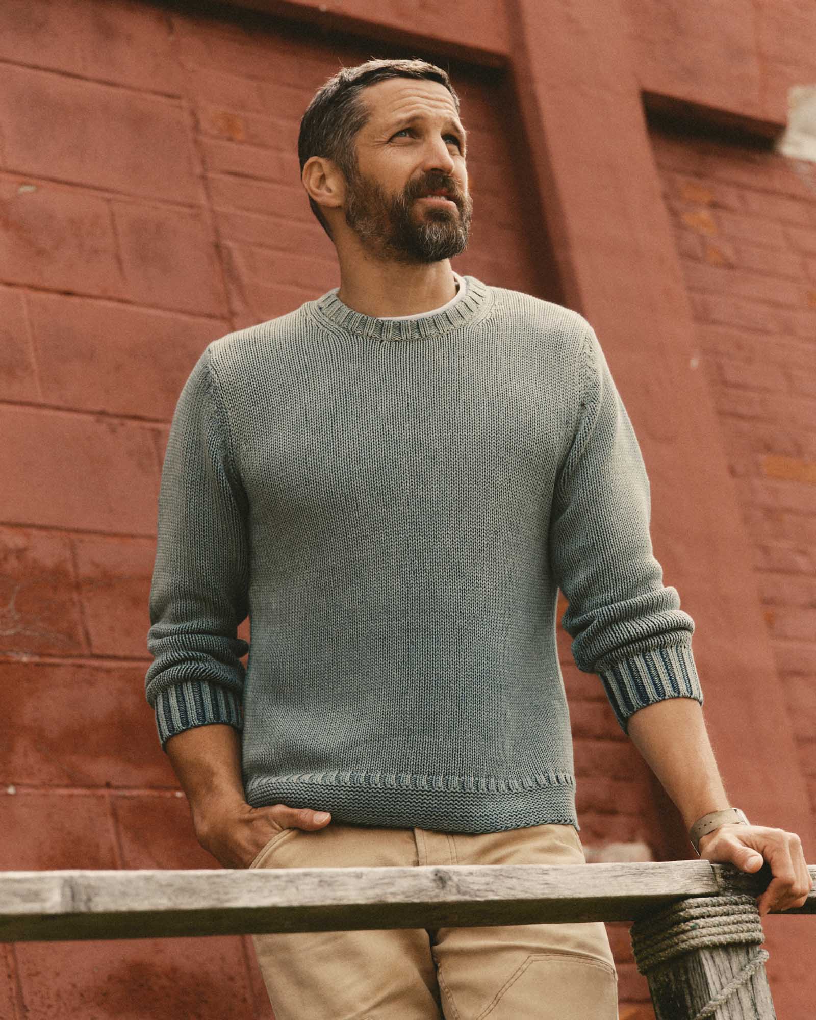 fit model posing in The Dory Crew Sweater in Washed Indigo, Knits by Taylor Stitch