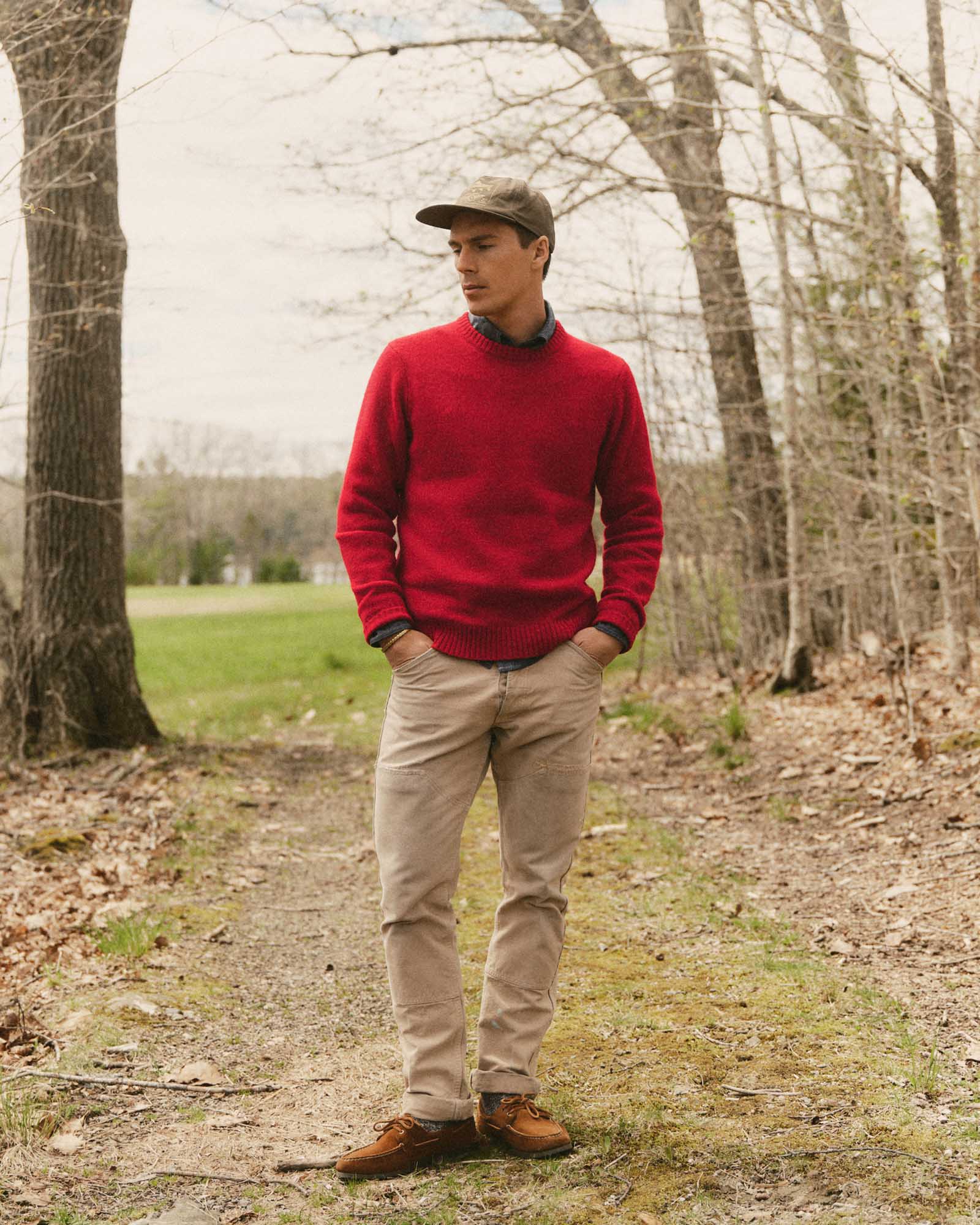 fit model posing in The Eastmoor Sweater in Claret Wool, Knits by Taylor Stitch