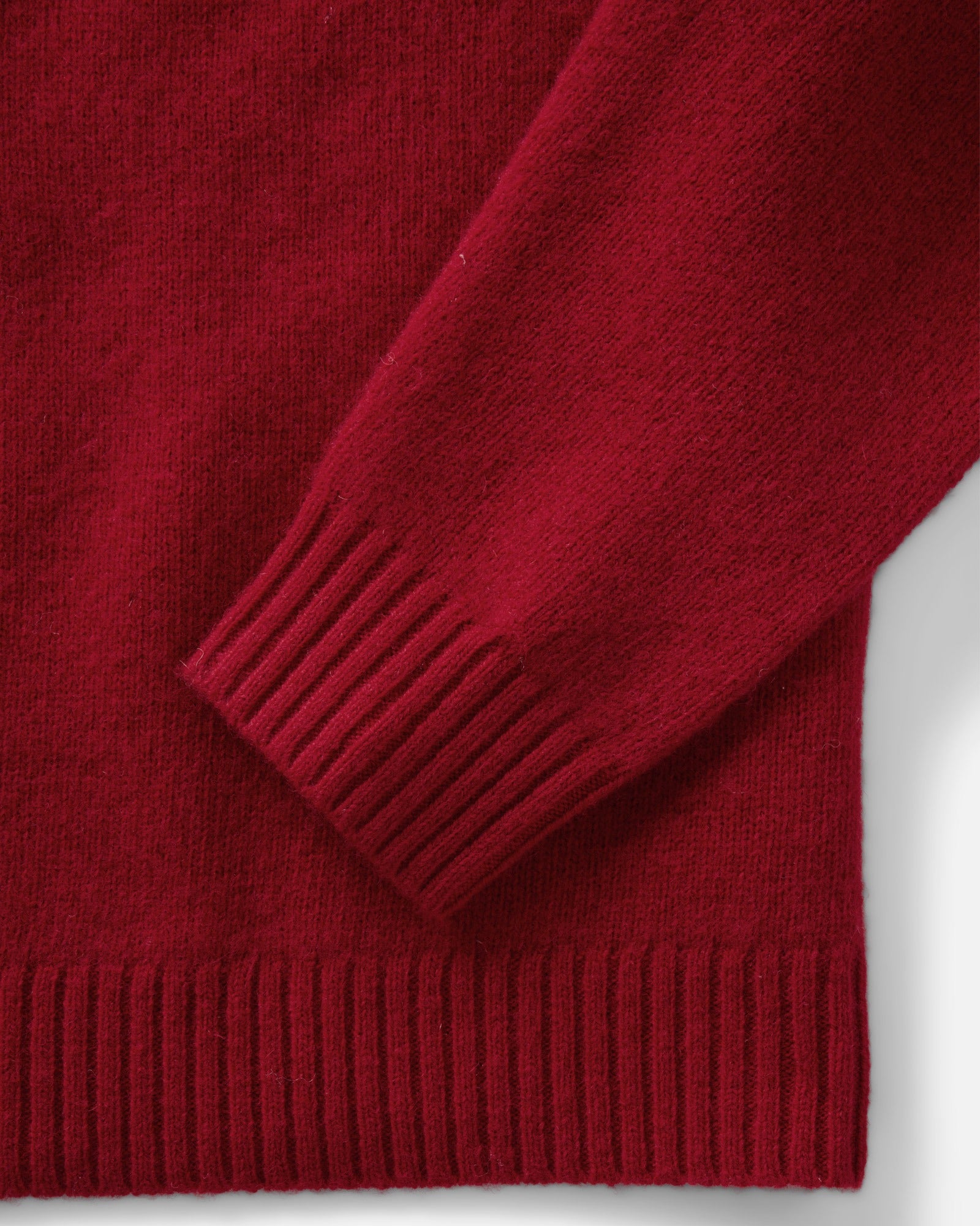 material shot of the sleeve on The Eastmoor Sweater in Claret Wool, Knits by Taylor Stitch