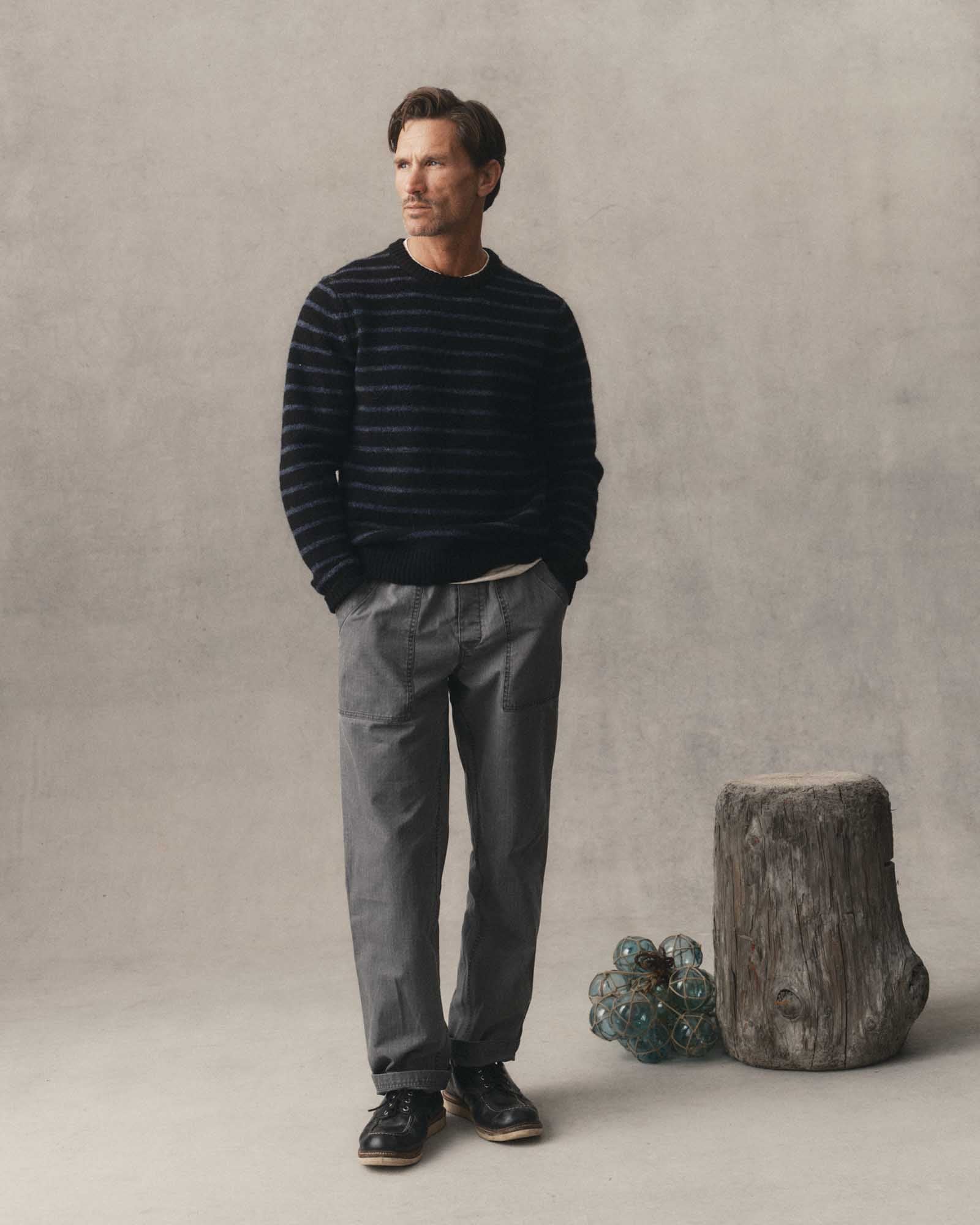 fit model posing in The Eastmoor Sweater in Coal Stripe Wool, Knits by Taylor Stitch