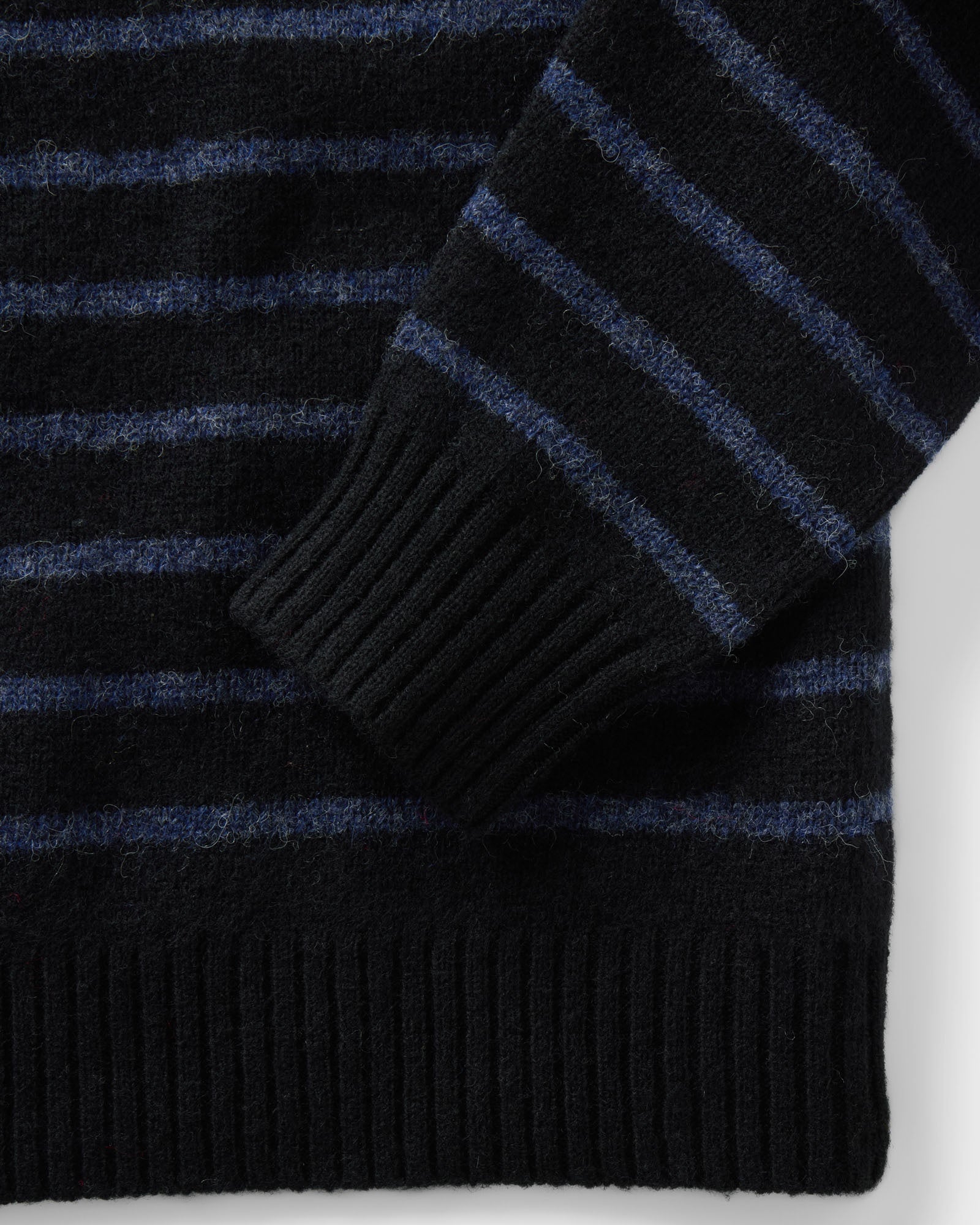 material shot of the sleeve on The Eastmoor Sweater in Coal Stripe Wool, Knits by Taylor Stitch