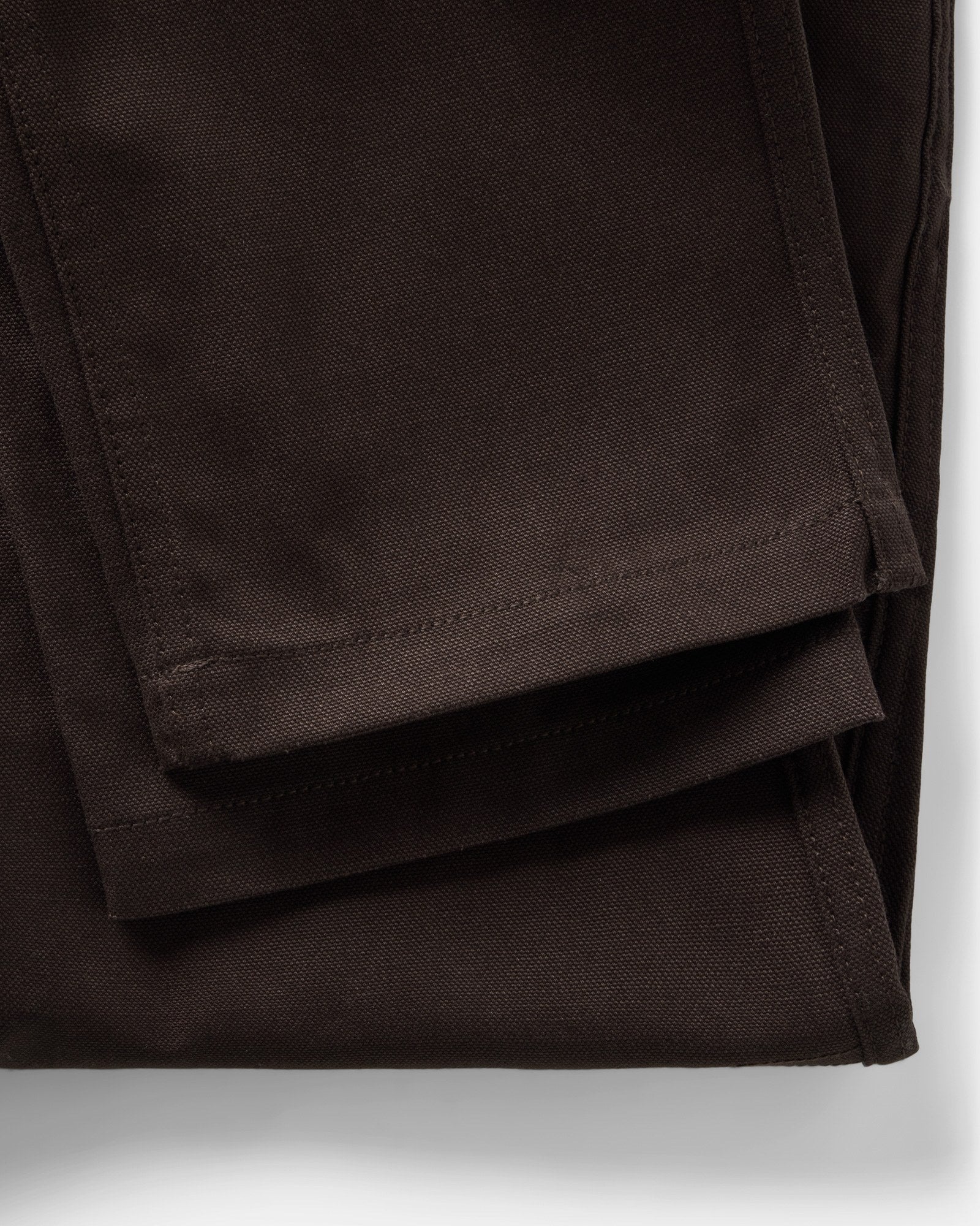 material shot of the bottom hem on The Good Acre Chore Pant in Coffee Canvas, Bottoms by Taylor Stitch