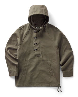 flatlay of The Hatteras Anorak in Fatigue Olive Dry Wax Canvas